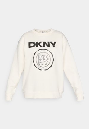 Hvit hettegenser med svart DKNY-logo i fet skrift og sirkulært design. Har ribbestrikkede mansjetter og nederkant med et mykt, teksturert stoff.
