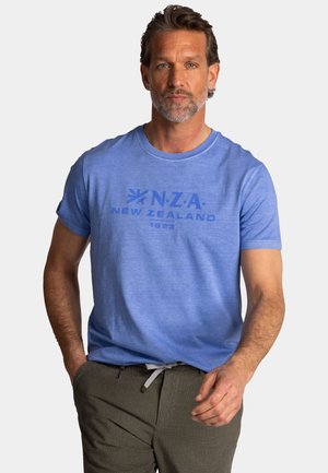 Light blue cotton t-shirt featuring a crew neck, short sleeves, and a printed logo design in darker blue. Pairing with gray pants.