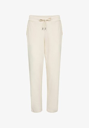 Krém színű melegítőnadrág puha anyagból. Derékrészen húzózsinórral és oldalzsebekkel, melyeken texturált díszítések találhatók. Egyenes szárú kialakítás.