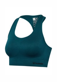 Bezszwowy sportowy biustonosz miętowy z tyłem typu racerback, wyściełanymi miseczkami i logo "hummel" na dolnym pasku, pokazany na białym tle.