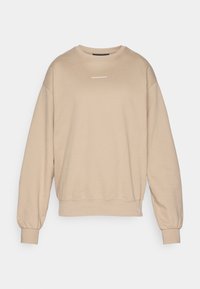Beige sweatshirt van zachte stof, met een ronde hals, ribgebreide boorden en een klein wit logo op de borst. Gestructureerde en relaxed fit.