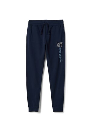 Pantalones de chándal azul marino hechos de tela suave, con cintura elástica con cordón, puños acanalados y texto gráfico impreso en el costado.