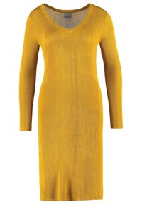 Robe en maille jaune moutarde à manches longues, longueur genou, avec col en V et silhouette ajustée.