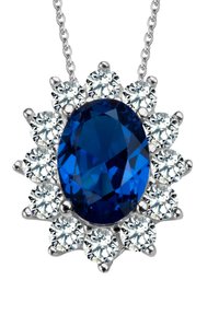 Niebieski owalny wisior z kamienia, otoczony okrągłymi przezroczystymi kamieniami. Srebrny łańcuszek i metalowe akcenty. Gładka powierzchnia, refleksyjny połysk.