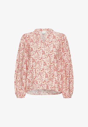 Blouse légère et fluide en crème avec un motif floral rouge. Dotée d'un col en V et de manches froncées, cette pièce se caractérise par sa texture douce et sa coupe décontractée.