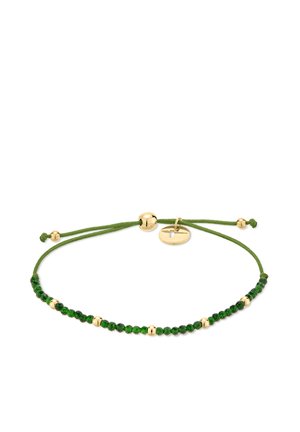 Adjustable green cord bracelet with small dark green beads and spaced gold beads, featuring a round gold charm and gold bead slider closure.
