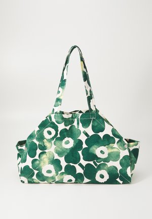 Green and white floral print bag, made of fabric, featuring two handles, rectangular shape, and side snap closures.