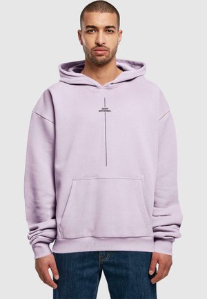 Light purple oversized hoodie with a front pocket and a black text design reading "I THINK DIFFERENT." Made of soft fabric, with a drawstring hood.