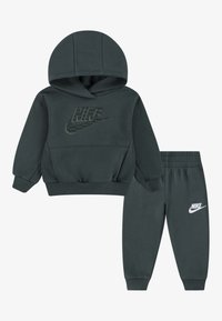 Nike Sportswear FUTURA WRAP PANT UNISEX SET - Dresside alumine osa - vintage green