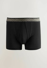 Schwarze Boxershorts mit einem dekorativen goldenen griechischen Schlüssel-Muster am elastischen Bund. Hergestellt aus einem glatten, dehnbaren Stoff. Mit Vorderöffnung.