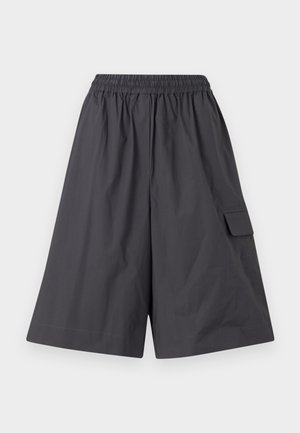 Mørkegrå shorts med elastisk talje, glat front og sidelomme. Fremstillet af et let materiale. Løs, bred benstruktur.