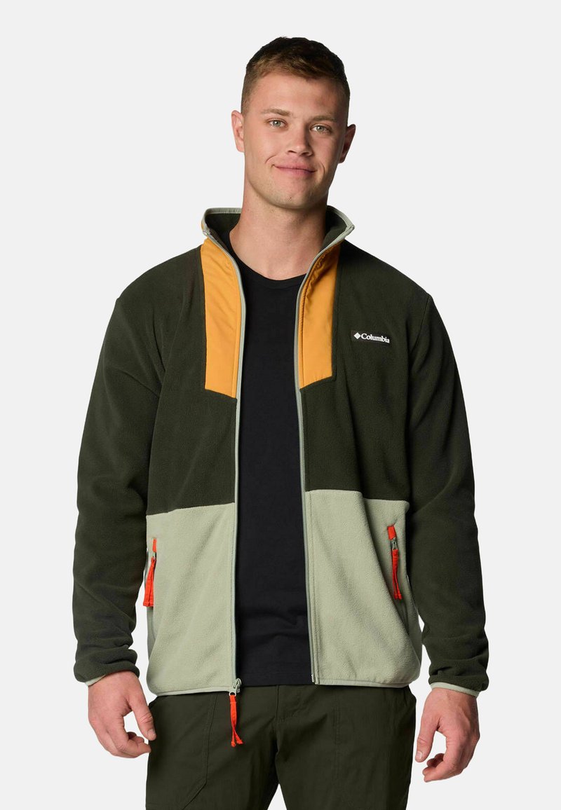 Fleece jacket featuring dark green, light green, and orange color blocks, with zippered pockets and a high collar. Textured fabric.