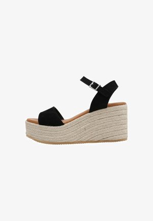 Sandalias de cuña negras con plataforma, parte superior de ante, diseño de punta abierta, correa ajustable en el tobillo y media suela de yute trenzado con un acabado texturizado.