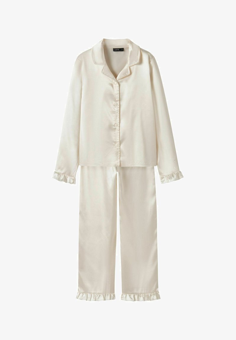 Satin pajama set in off-white, includes button-up top with collar and long sleeves, matching pants with ruffled cuffs. Smooth texture.