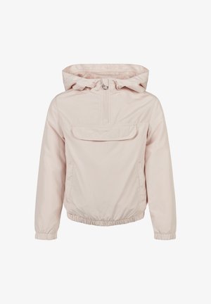 Jasnoróżowa kurtka z zamkiem błyskawicznym do ćwierć długości, z przednią kieszenią, elastycznymi mankietami i dołem, noszona na szare legginsy i białe sneakersy. Gładka tekstura.