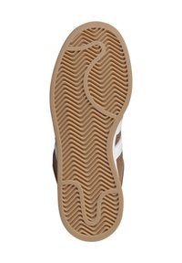 Brown rubber shoe sole with vertical and horizontal wave patterns, featuring a tan, textured surface and white accent stripes on the sides.