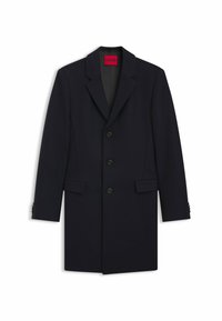 Cappotto navy in misto lana, caratterizzato da rever a punta, design a un petto, cinque bottoni e tasche frontali inclinate.