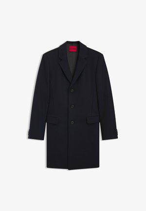 Manteau bleu marine en mélange de laine, avec un col à revers, un design à boutonnage simple, cinq boutons et des poches avant angulaires.