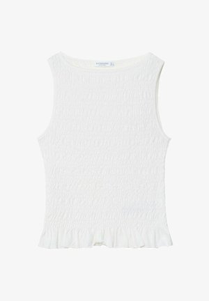 Top bianco senza maniche con smocking texturizzato, scollatura rotonda e orlo a volant. Realizzato in tessuto leggero, adatto per il clima caldo.