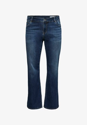 Jean en denim bleu foncé avec jambes légèrement évasées, poches avant, fermeture à boutons, et légère décoloration sur les cuisses.