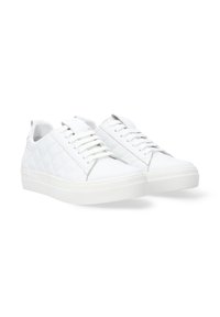 White sneakers with a textured quilted side panel, flat laces, and a rubber sole. Features a smooth leather upper and padded collar.