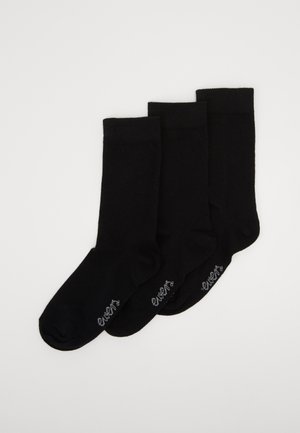 Schwarze Knöchelsocken im Dreierpack. Gefertigt aus einem glatten Material mit einem gerippten Bündchen und dezentem Graudruck an der Seite.