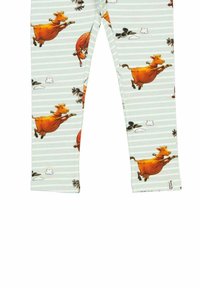 Leggings med ett ljusblått randigt mönster med bilder av hoppande orange kor och flygande fåglar. Tillverkade av mjukt, stretchigt tyg.