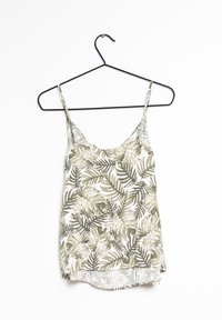 Satinlinne med tunna axelband, prytt med ett mönster av gröna och beige tropiska löv på en vit bakgrund, rundad nederkant.