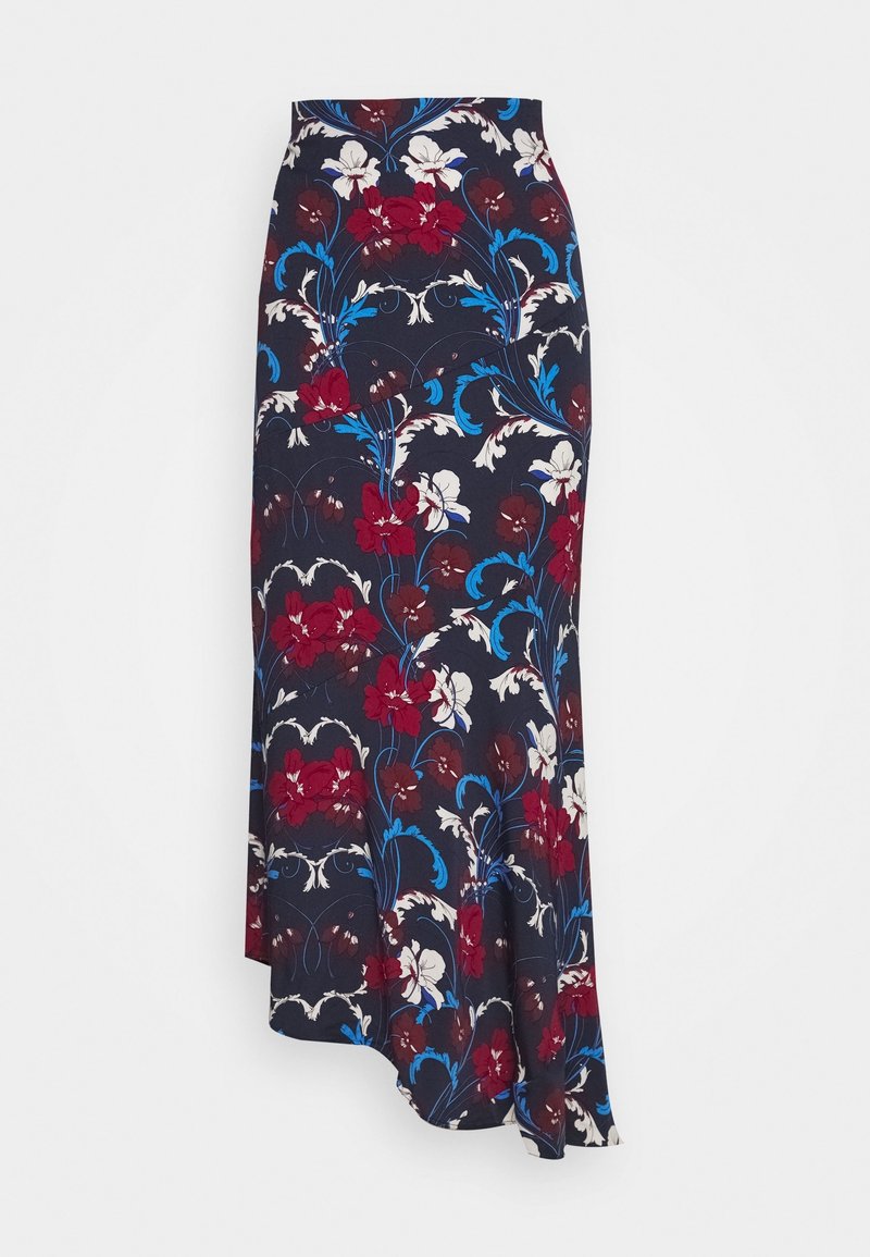 Longue jupe bleu marine avec motif floral rouge, blanc et bleu et ourlet asymétrique sur fond blanc.
