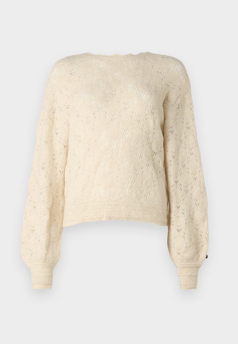 Maglione lavorato a maglia color crema con un motivo a diamante testurizzato, maniche lunghe a sbuffo e polsini a coste. Il design corto aggiunge un tocco moderno.