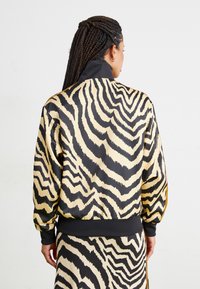 adidas Originals ADIDAS FARM RIO FIREBIRD TRACK - Treningsjakke - crystal sand