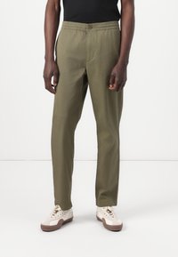 Lacoste Pantaloni - olive