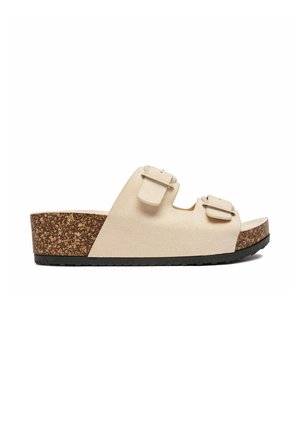Sandalia de ante beige tipo slide con dos hebillas ajustables, suela de cuña de corcho y suela negra con dibujo vista de perfil lateral.