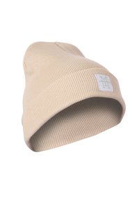 Beige knitted beanie hat with a ribbed texture, featuring a folded cuff and a small square logo patch on the front.