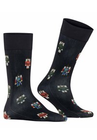 Czarne skarpetki z kolorowymi wzorami w postaci bałwanów w różnych strojach, wykonane z miękkiego, elastycznego materiału dla wygody i dopasowania.