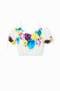 Blomstrete crop topp med hvit bakgrunn, livlige flerfargede blomster, korte puff ermer og elastisk linning for en tett passform.