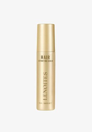 Gouden cilindrische fles haaractiverende serum met de tekst "HAIR" en "LENOITES" in contrasterend donker lettertype, 75 ml / 2,53 fl. oz. capaciteit.