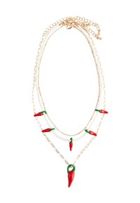 Gold-tone layered necklace featuring red and green chili pepper accents, with white beads and a textured chain design.
