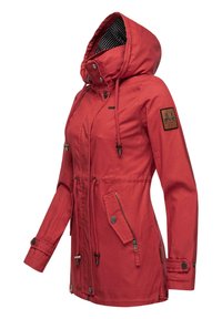 Red, hooded jacket in a soft, textured fabric. Features drawstrings, zippered pockets, and a striped inner lining. Adjustable cuffs.