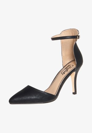 Chaussure à talon aiguille noire à bout pointu avec une sangle de cheville et une doublure intérieure beige, conçue pour des tenues formelles ou de soirée.