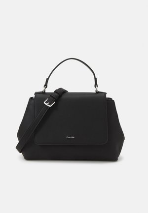 Black handbag with a structured design, smooth faux leather material, short top handle, and an adjustable shoulder strap. Features a flap closure.