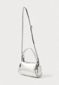 Silver crossbody bag in metallic fabric, featuring a rectangular shape, smooth texture, and a detachable strap with a clip.