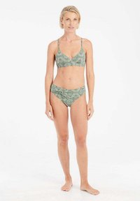 Žalias raštuotas bikinis su braletiniu viršumi ir žemais šortais. Savybės: plonos petnešos ir tekstūruotas audinio dizainas.