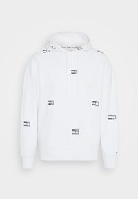 Witte hoodie van katoen met een zachte textuur, voorzien van verspreide marineblauwe logopatches en een capuchon met aantrekkoorden. Lange mouwen met geribbelde boorden.