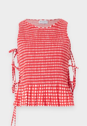 Haut sans manches à carreaux rouges et blancs avec corsage froncé, liens latéraux et ourlet à volants, étiqueté Maisonétre.