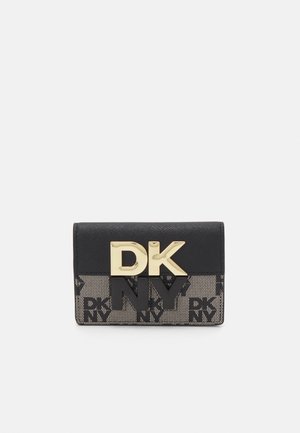 Black and beige wallet featuring a textured fabric, gold-tone "DK" logo, and patterned accents, with a compact, rectangular design.