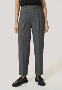 Gray tailored trousers with a high waist, pleated front, and two decorative buttons. Crafted from textured fabric, featuring a straight leg design.