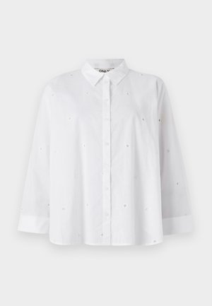 Witte button-up shirt gemaakt van lichtgewicht stof, met kleine hartvormige uitsparingen, lange mouwen en een klassieke kraag.