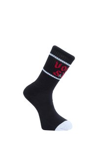 Chaussettes noires avec texture côtelée, bande d'accent blanche et texte graphique rouge. Caractéristiques d'un embout blanc et d'un design sportif adapté à un usage décontracté.