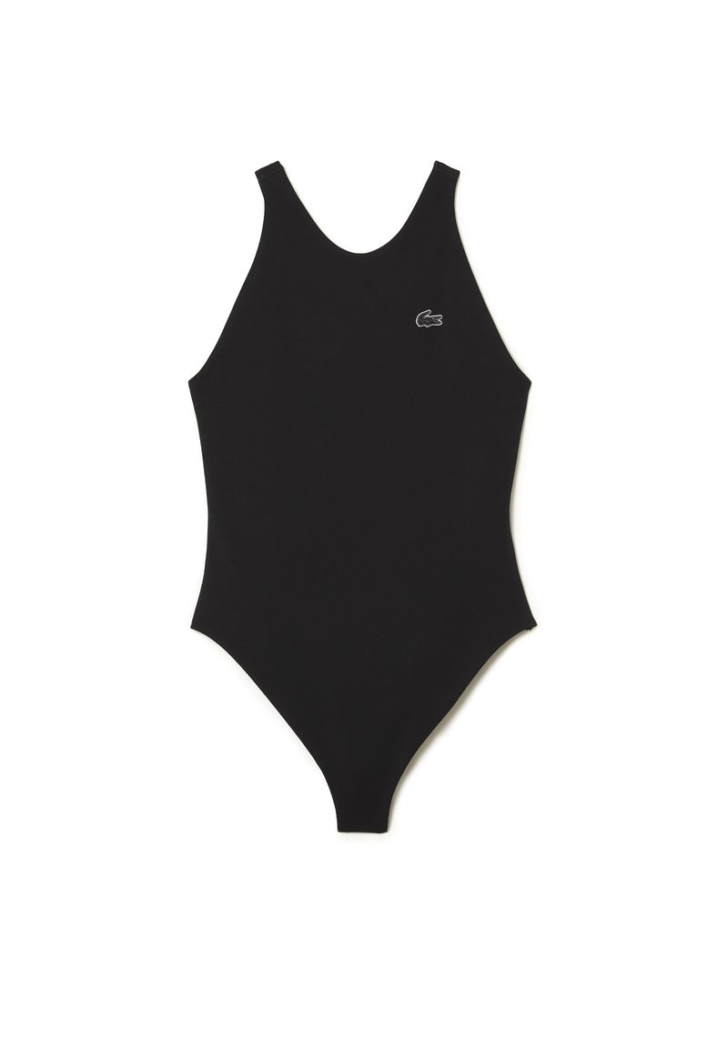 Maillot de bain noir une pièce avec un design à jambe haute et de larges bretelles. Présente un petit logo brodé près de la poitrine gauche.